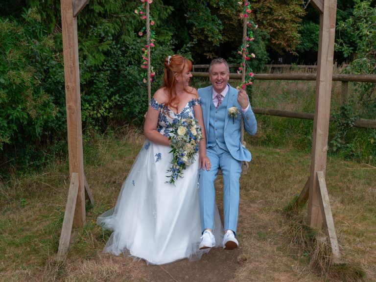 Couple laughing together at their garden wedding
