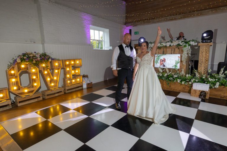 First dance under the LOVE lights at The Barns at Alswick