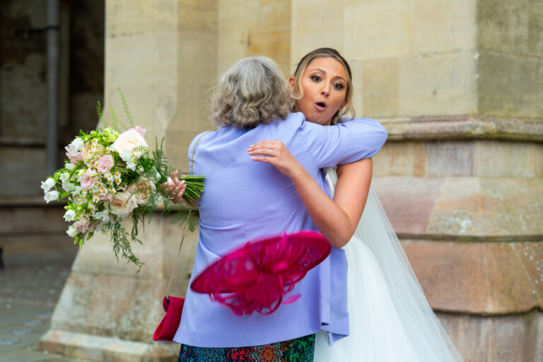 Mother-in-Law Hug - candid wedding photo by TME Photography Herts